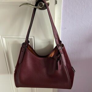 Beautiful burgundy Coach purse.